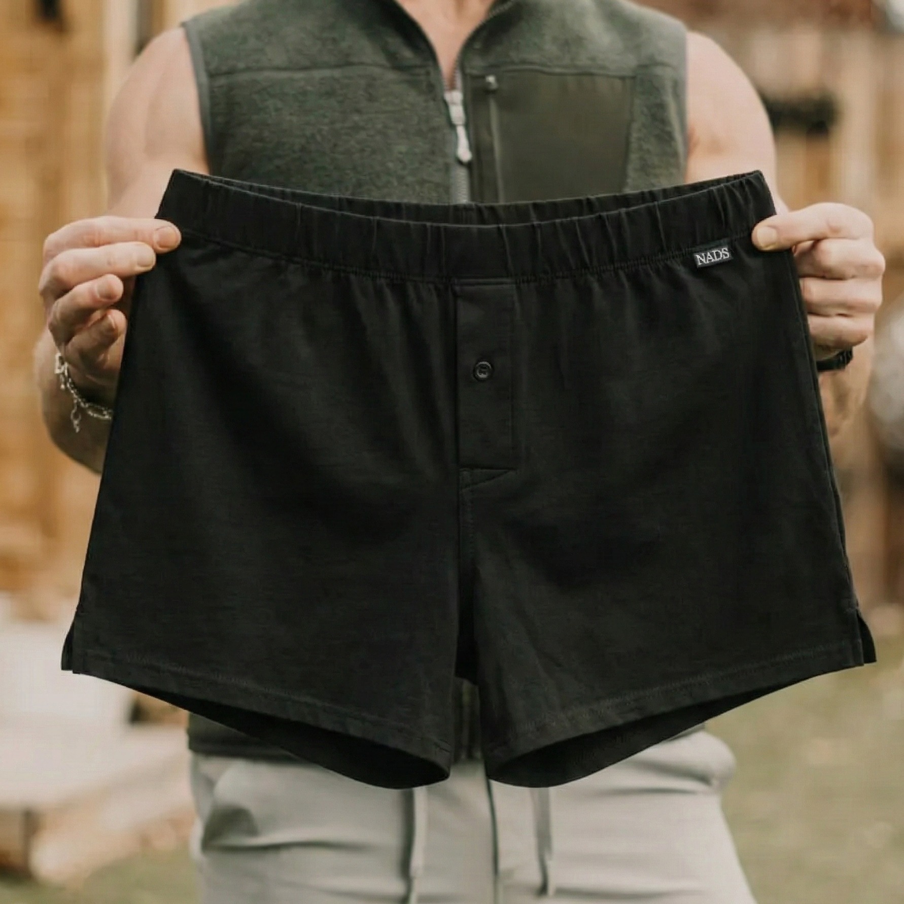 Person holding black NADS boxers