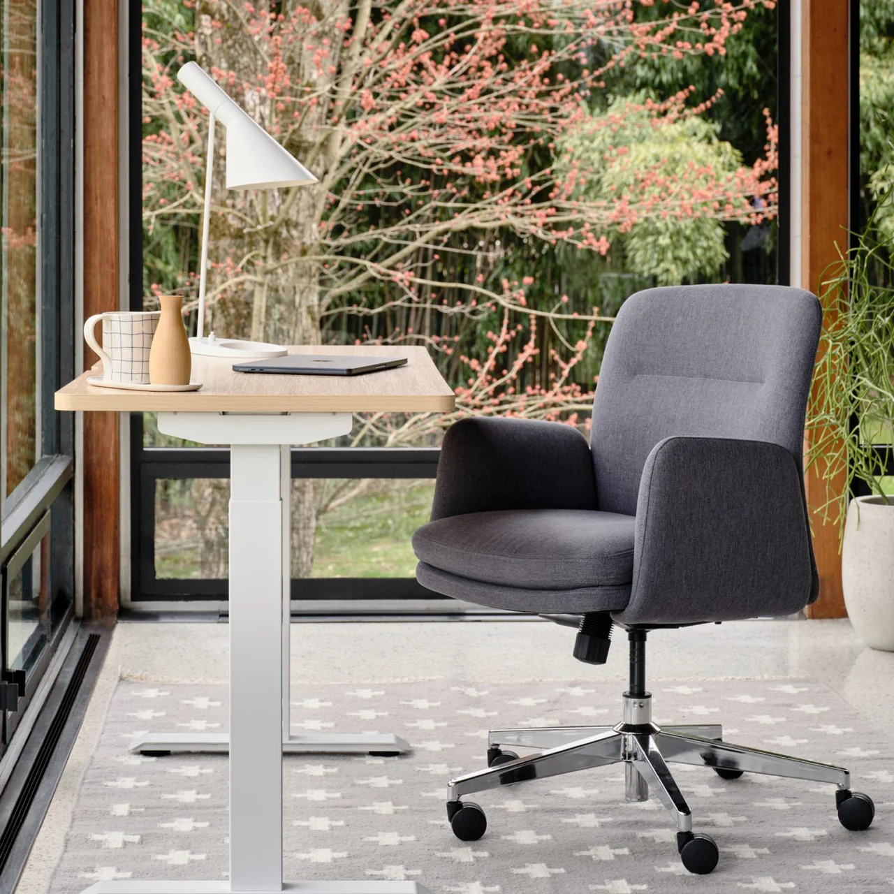 Modern home office with a view of trees