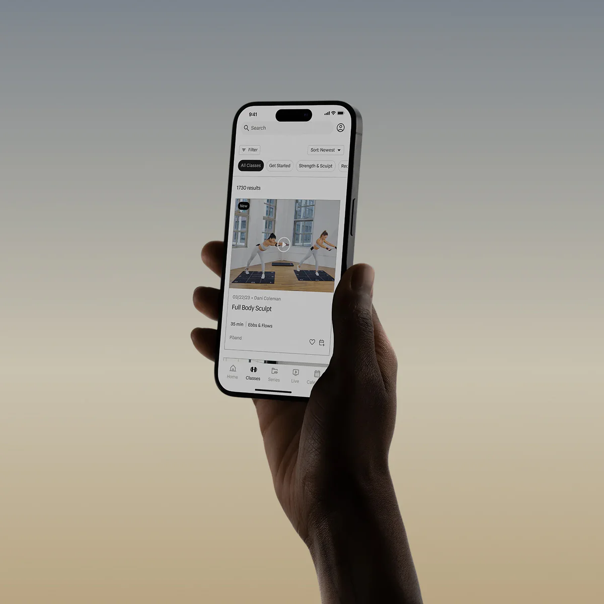 Hand holding a smartphone displaying a fitness app