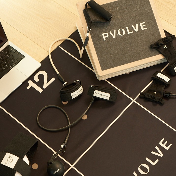 P.volve exercise equipment on a workout mat