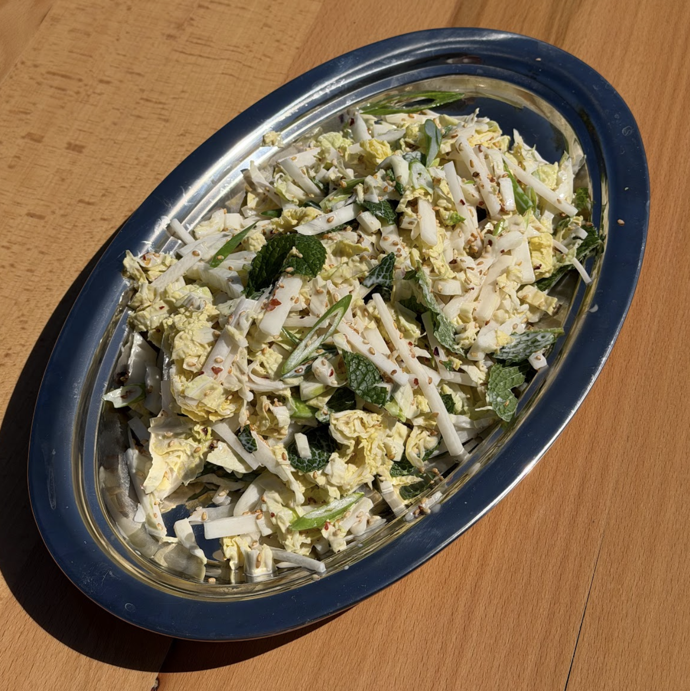 Coleslaw made with Ayoh Miso Mayo, mint, and sesame seeds