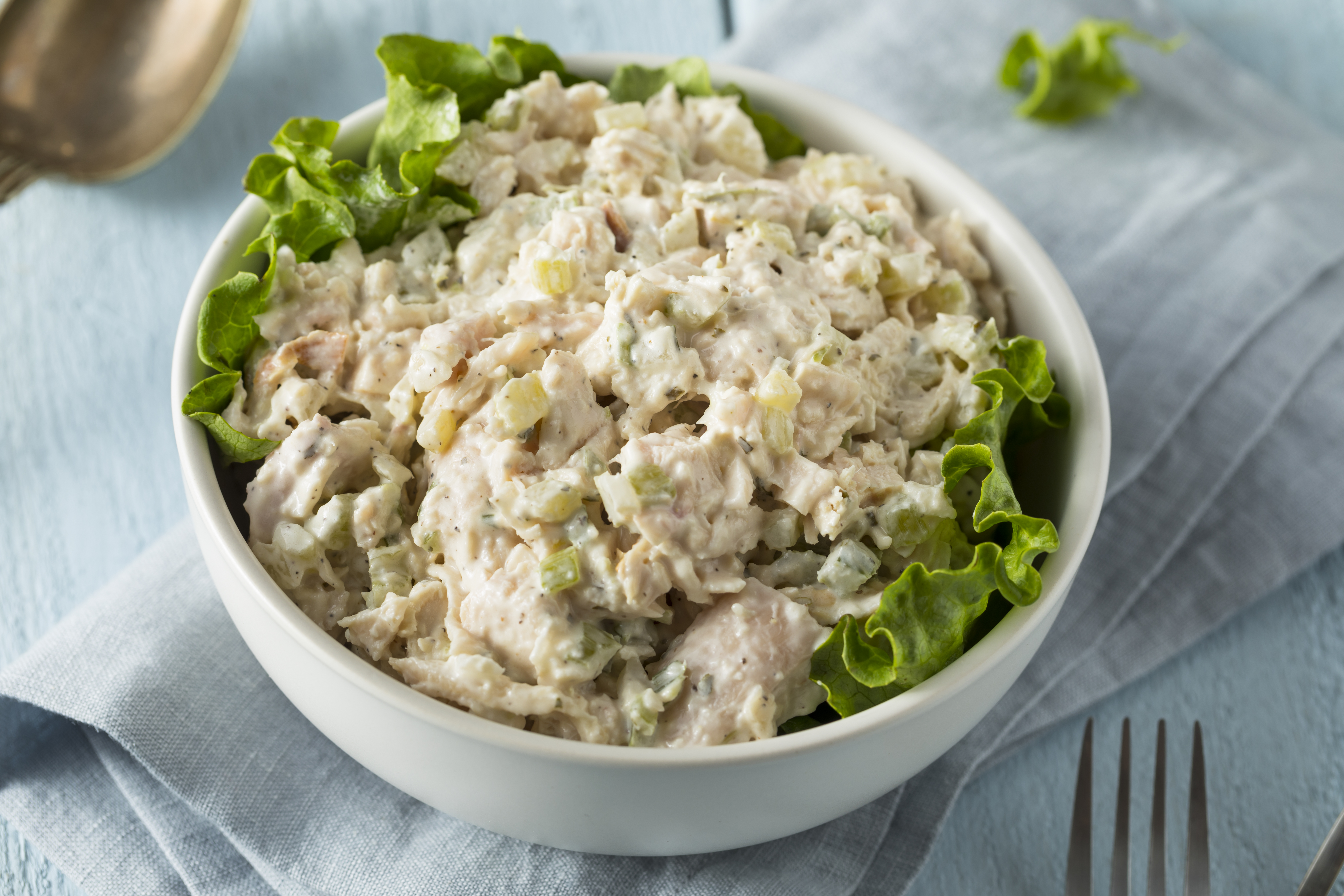 Chicken salad made with Ayoh Dill Pickle Mayo and garnished with greens