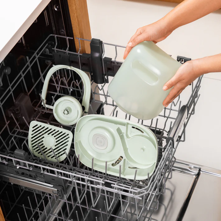 Person loading dishwasher with humidifer