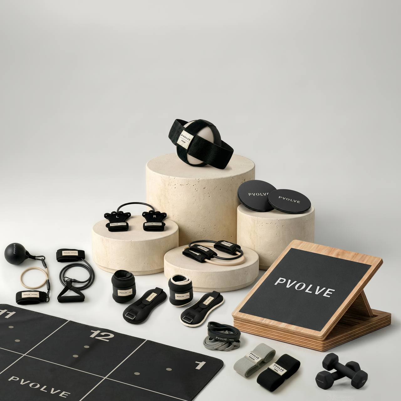 Collection of the PVOLVE fitness equipment included in the Total Transformation Bundle on display