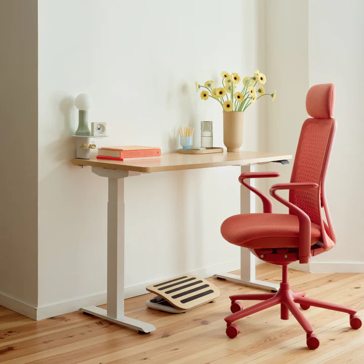 Home office setup with a Coral Verve Chair and desk
