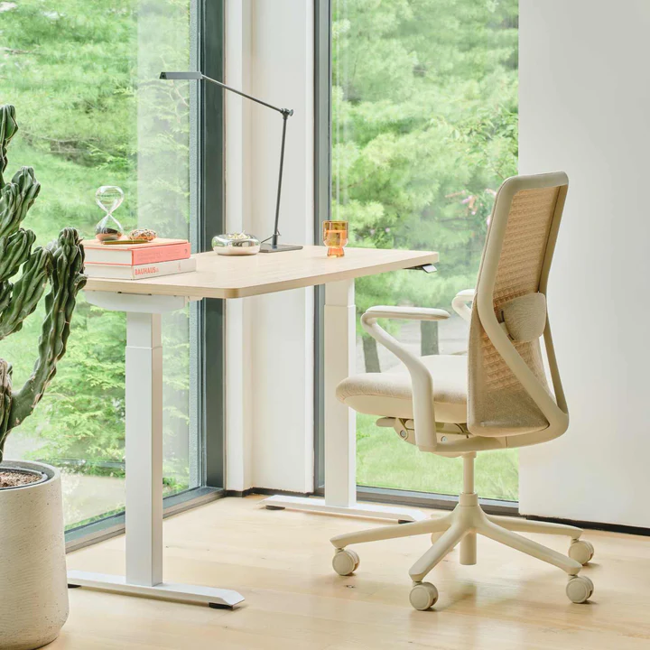 Wheat Verve Chair near windows at a desk