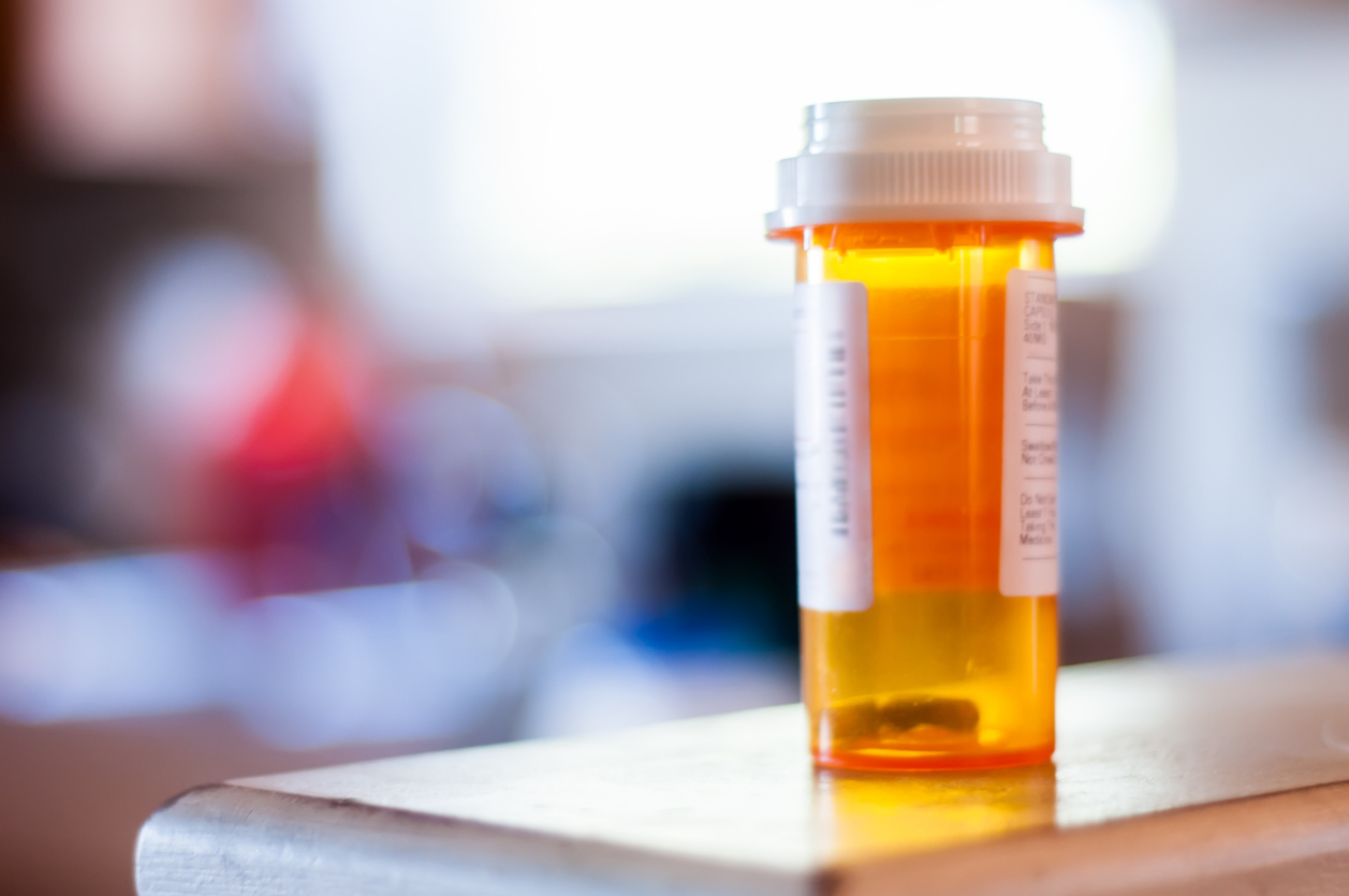 A prescription pill bottle on a table