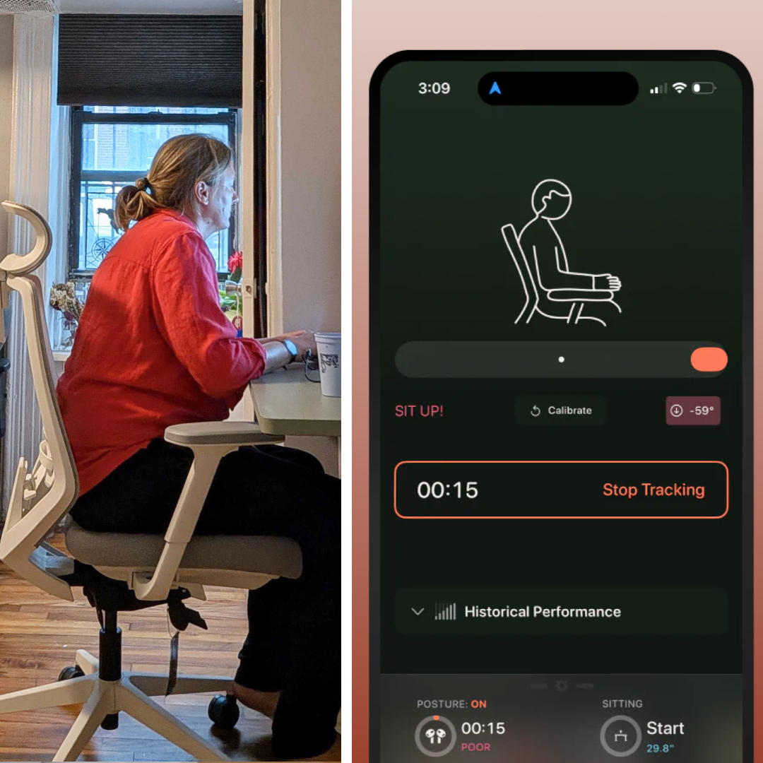 Writer sitting at a desk with a Branch Duo Standing Desk posture tracking app on a smartphone