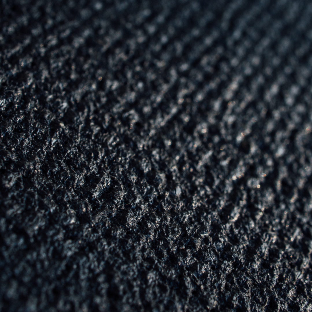 Close up of a soaked blue doormat