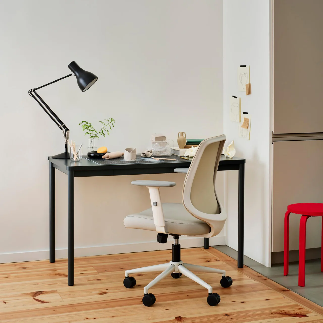 The Branch Daily Desk with a lamp and chair in a modern apartment setting
