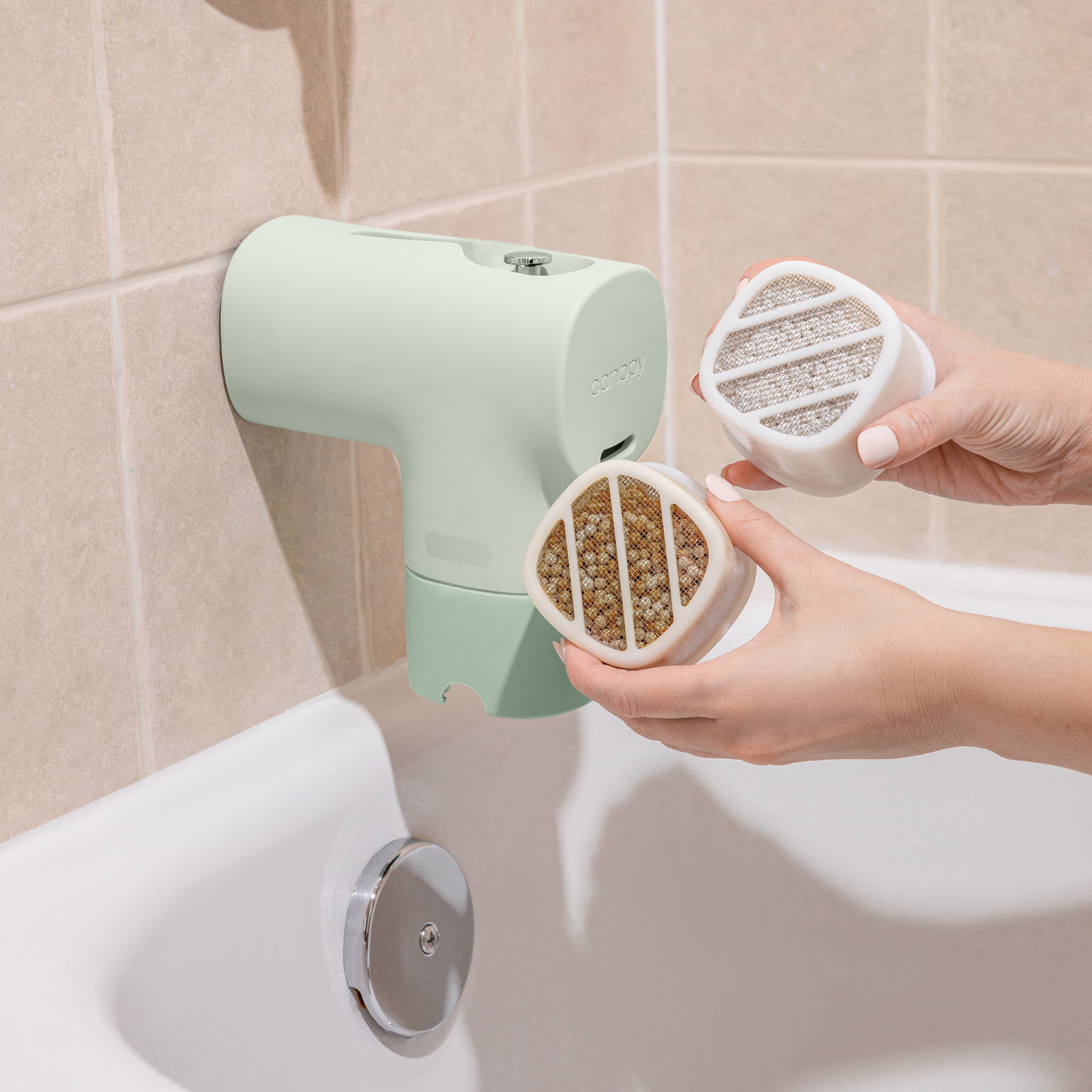 A person installs a Baby Bath Tub Filter