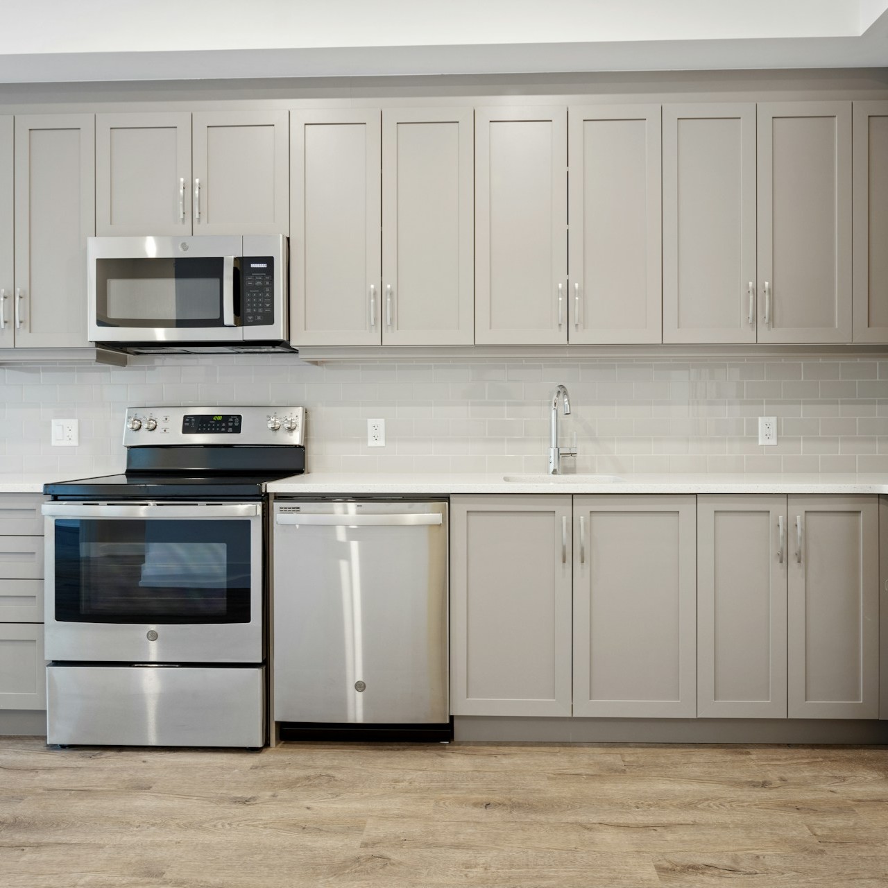 Single-Wall Kitchen Single-wall kitchen with stainless steel appliances and gray cabinets