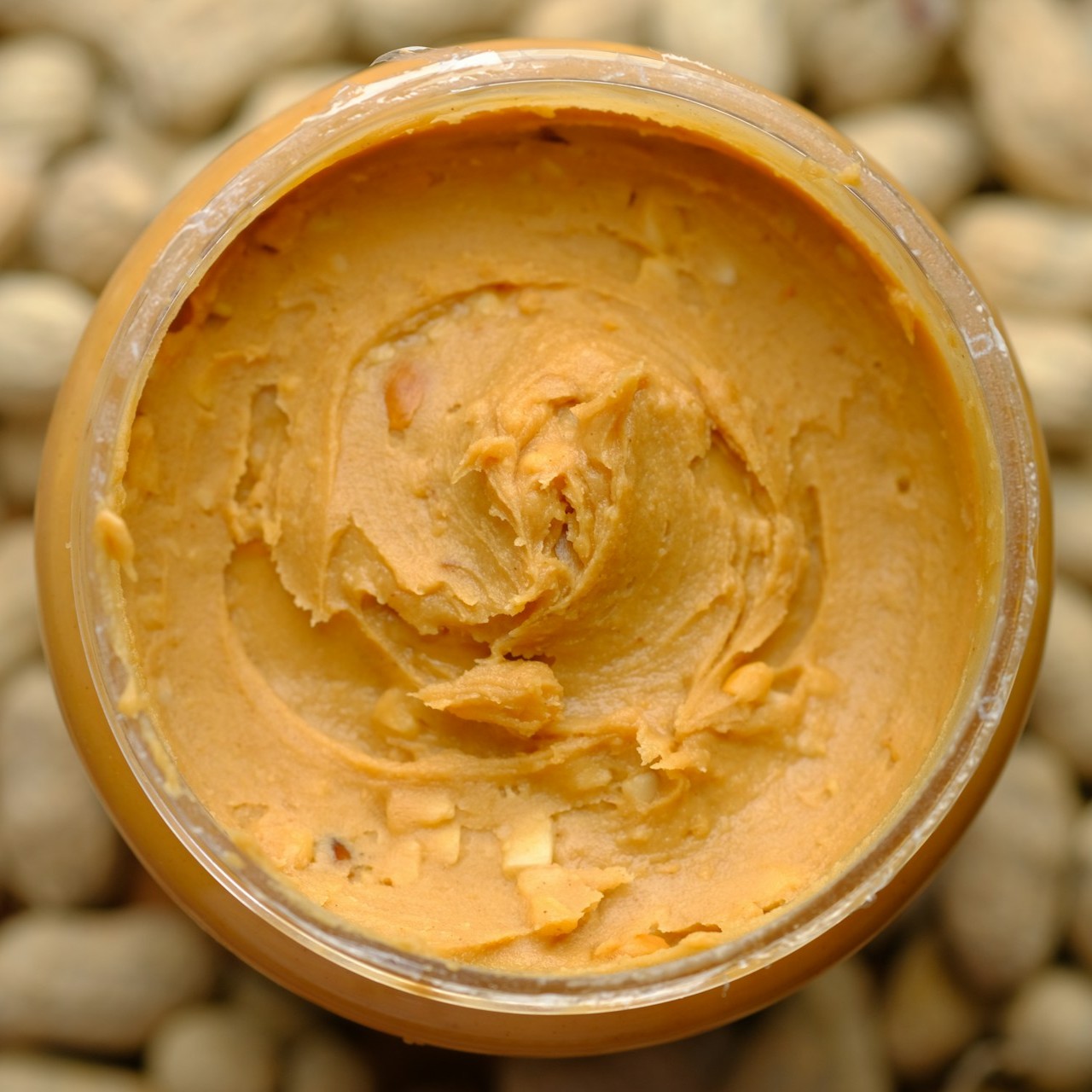 Close up of natural peanut butter in a jar