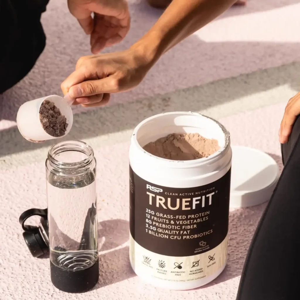 Hand pouring truefit powder into water bottle Hand pouring truefit powder into water bottle