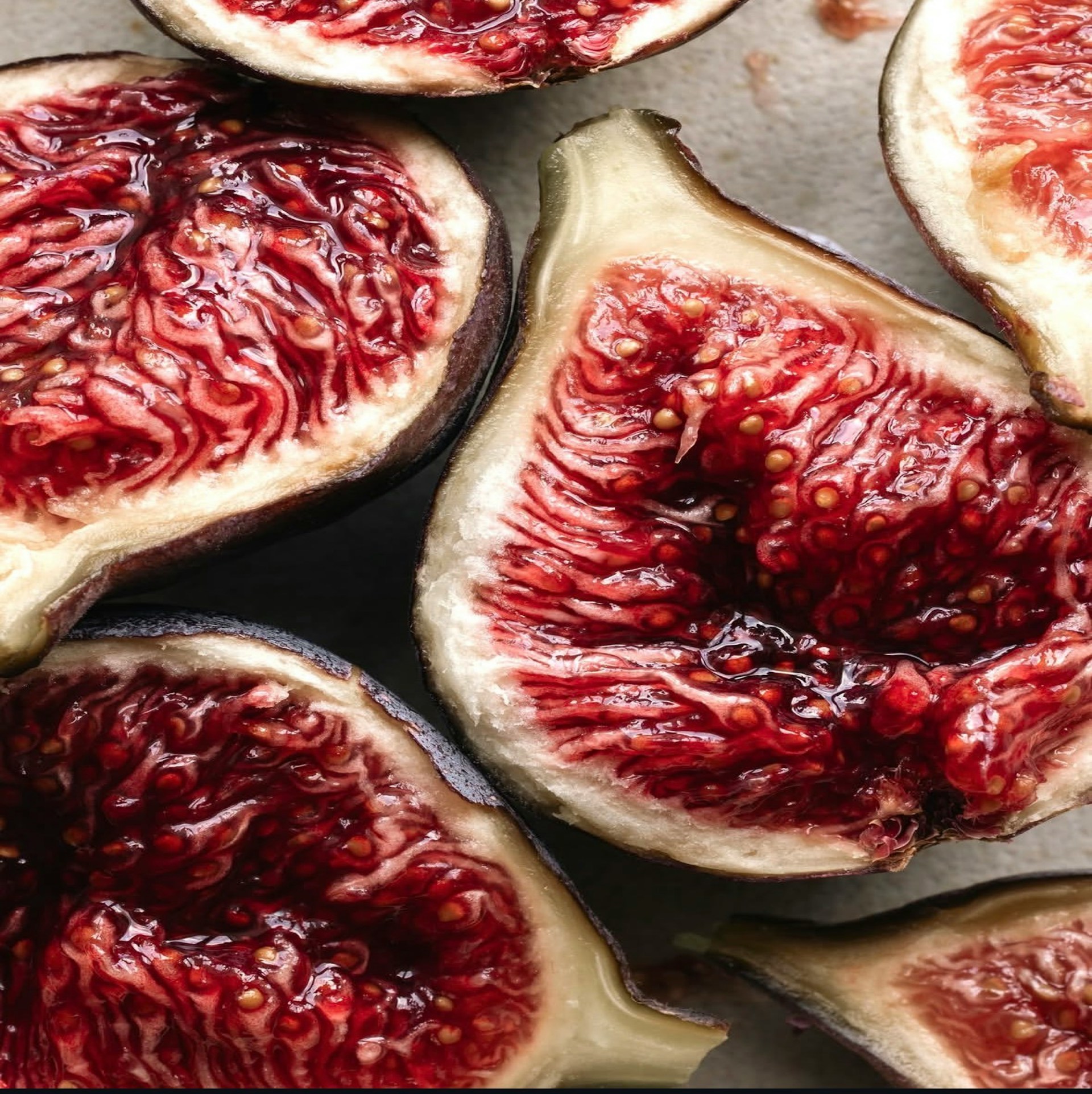 Close-up of ripe figs showcasing their rich, red interiors