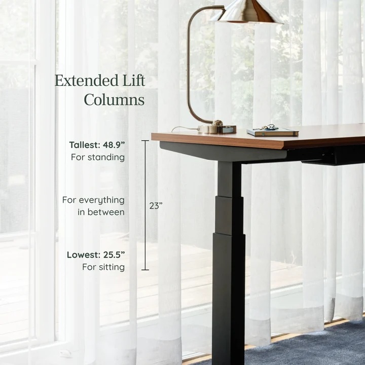 Adjustable L-Standing Desk with Lift Columns Adjustable L-Standing Desk with extended lift columns and a lamp