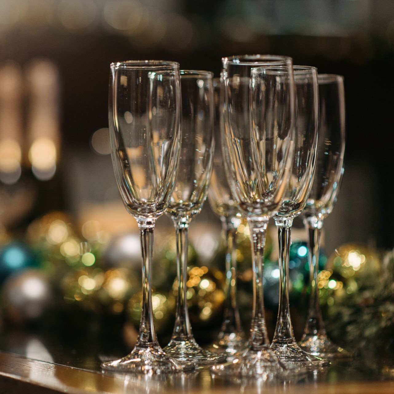 Wine Glasses Ready for Festive Gatherings Empty wine glasses are arranged on a table with festive decorations