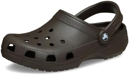 Brown Slip-On Clog Brown slip-on clog with ventilation holes and adjustable strap.