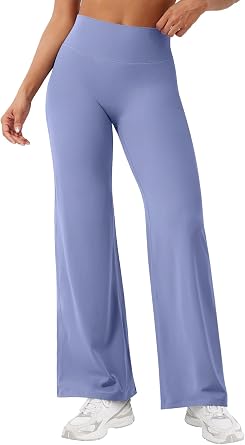 Blue High-Waisted Yoga Pants Person wearing blue high-waisted yoga pants and white sneakers.
