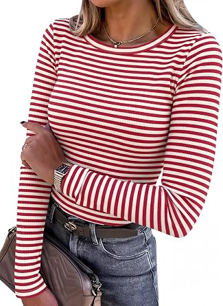 Striped Long-Sleeve Shirt Fashion Woman in a red and white striped long-sleeve shirt holds a purse.