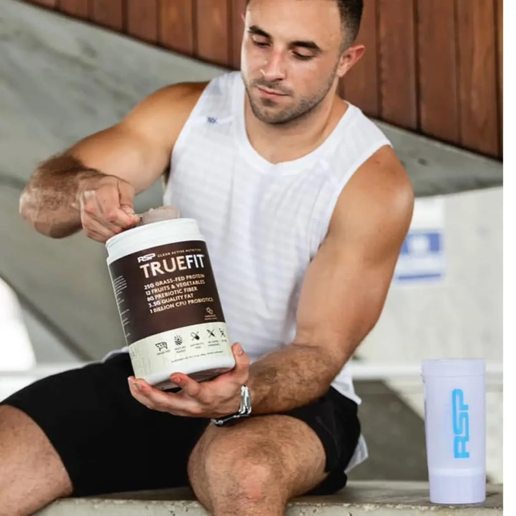 man scooping truefit out of container man scooping truefit out of container