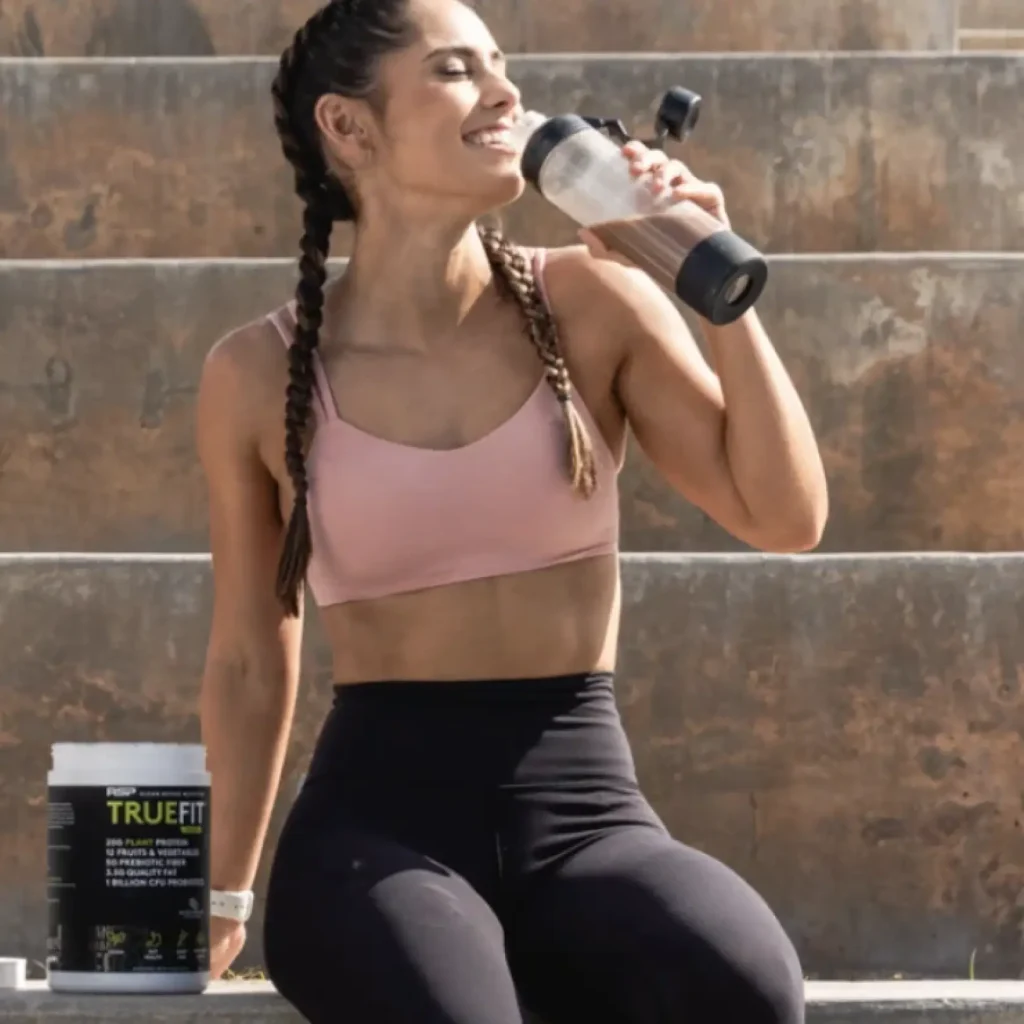 woman smiling and drinking truefit woman smiling and drinking truefit