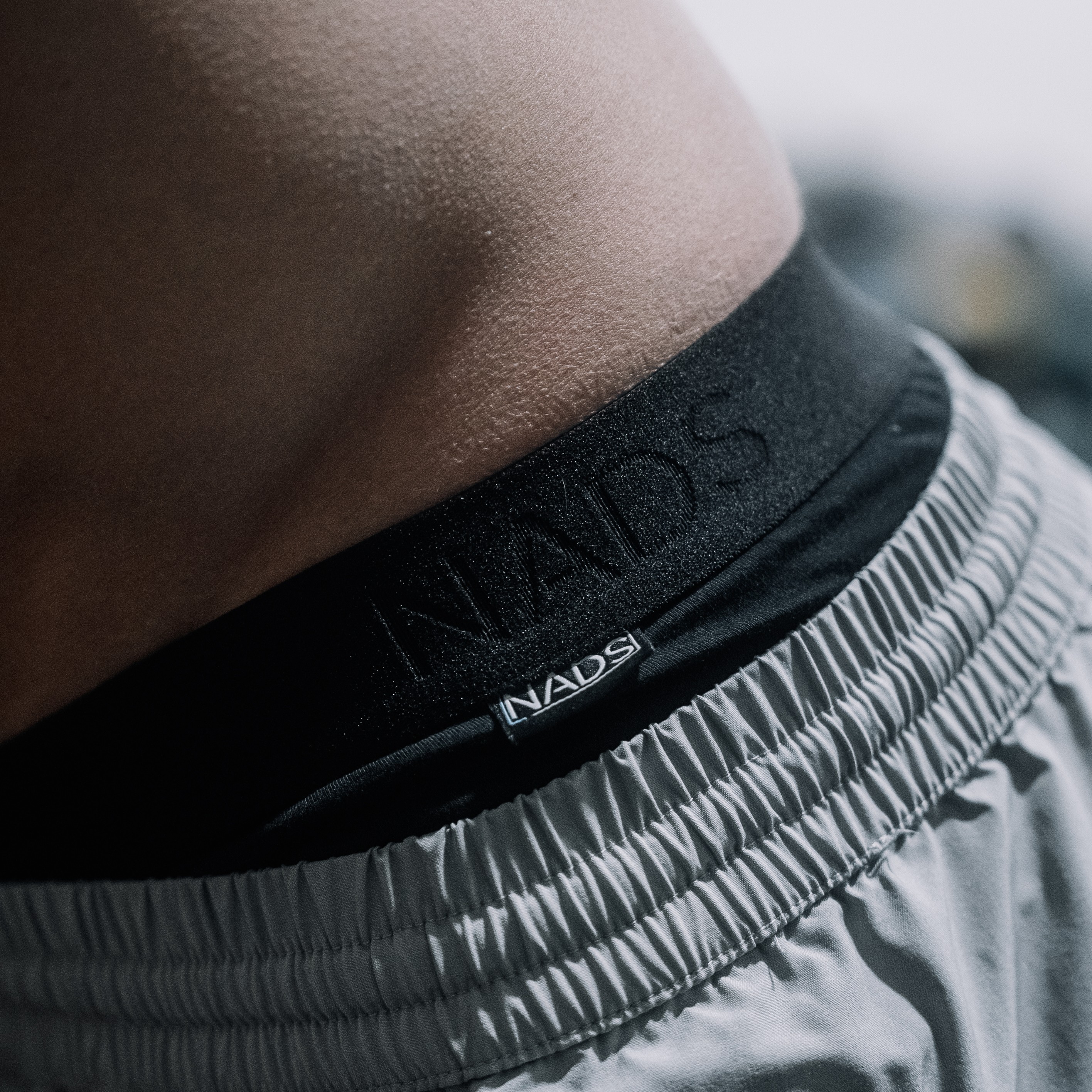 NADS Organic Cotton Boxer Briefs with Shorts Person wearing NADS Organic Cotton Boxer Briefs with waistband visible above shorts